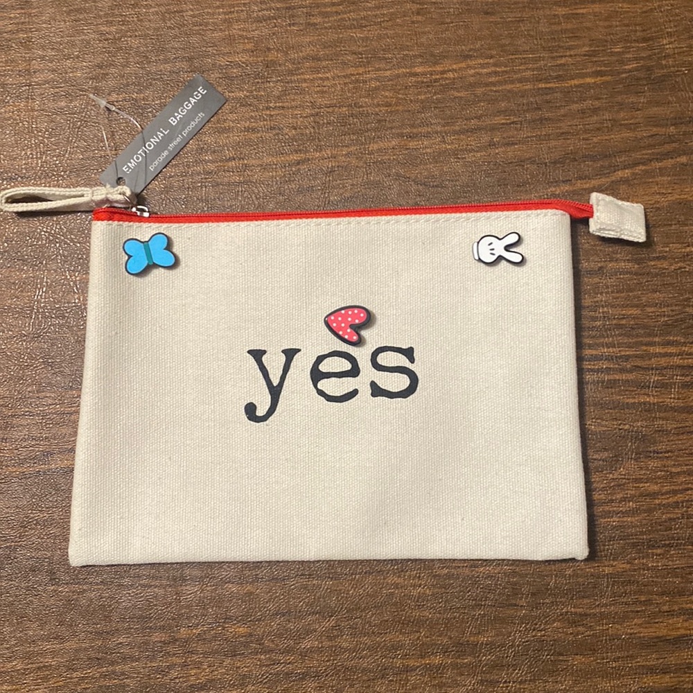 NWT Super cute canvas bag with zipper. 8.5x6”